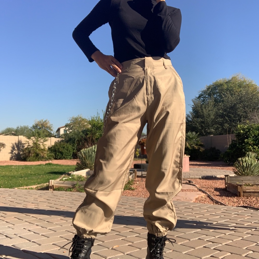 Color tan, brand name unknown, size medium, with a chain.